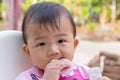 Asian cute baby eating snack. Royalty Free Stock Photo