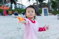 Asian cute baby girl enjoying sand toys. Royalty Free Stock Photo