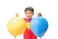 Asian cute boy holding two colorful big balloons. Creativity Royalty Free Stock Photo