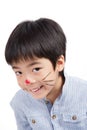 Asian cute boy paint his face and smiling