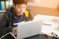 Asian cute boy using laptop computer. Royalty Free Stock Photo