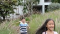 Asian cute child playing in the wheat field