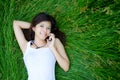 Asian cute girl lying on meadow Royalty Free Stock Photo