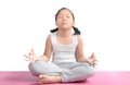 Asian cute girl sitting on floor meditating. Royalty Free Stock Photo