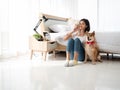 Asian cute girl sitting and playing with Japanese brown Shiba Inu dog and small white Maltese pedigree beside the bed in white Royalty Free Stock Photo