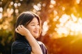 Asian cute girl teen innocent shy smiling happiness moment with nature sunshine beautiful background Royalty Free Stock Photo