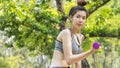 Asian cute healthy fit and firm slim girl teen happy to sitting workout with small dumbbell in position bicep curls lifting  at Royalty Free Stock Photo