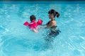 Asian cute little baby girl swimming underwater from mother Royalty Free Stock Photo