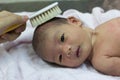 Asian cute new born baby comb hair.