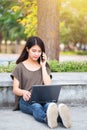 Asian Cute teen women calling smartphone and laptop modern lifestyle. Royalty Free Stock Photo