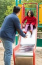 Asian dad and daughter on playground Royalty Free Stock Photo