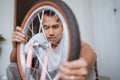 Asian dad puts on a wheel while assembling a bike