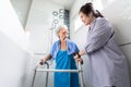 Asian daughter or female care assistant service, help,support senior woman taking a shower in bathroom,take care closely,happy Royalty Free Stock Photo