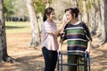 Asian daughter using wet wiping face for her senior mother,caring woman wipe sweat for elderly people by tissue paper while