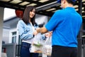 Asian delivery man delivering food, fruit, juice and vegetable to customer home Royalty Free Stock Photo