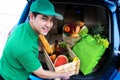 Asian delivery man in green t-shirt delivering food Royalty Free Stock Photo