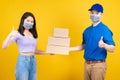 Asian Delivery man and woman customer wearing mask picking a package thumbs up Royalty Free Stock Photo