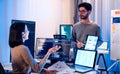 asian developer discussion about ai programing coding project in the night at office