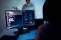 asian developer leads present code review session, pointing at code projected on the wall with colleagues teamwork and knowledge