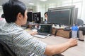 Asian Developer Using Laptop Computer Sitting Royalty Free Stock Photo
