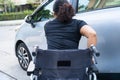 Asian disability woman on wheelchair getting in her car. Accessibility concept Royalty Free Stock Photo