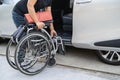 Asian disability woman on wheelchair getting in her car, Accessibility concept Royalty Free Stock Photo