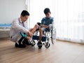 Asian disabled child visit paediatrician doctor to check ankle and leg pain from accident for recovery body and plan physical