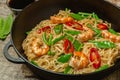 Asian dish of fried rice noodles with shrimp and vegetables Royalty Free Stock Photo