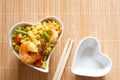 Asian dish in heart-shaped bowl, love asian food menu concept