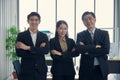 Asian diverse business people standing crossed arms with confident team