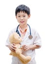 Asian doctor boy measuring temperature bear toy Royalty Free Stock Photo