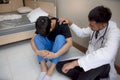 Doctor comforting patient in medical office patient receiving bad news and crying