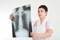 Asian doctor examining a lung radiography. Royalty Free Stock Photo
