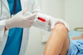 Asian doctor inject Hyaluronic acid platelet rich plasma into the knee of senior woman to walk without pain