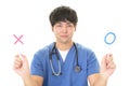 Asian doctor with a Yes or No sign Royalty Free Stock Photo