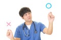 Asian doctor with a Yes or No sign Royalty Free Stock Photo