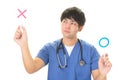 Asian doctor with a Yes or No sign Royalty Free Stock Photo