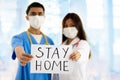 Asian doctor or nurse with Stay Home sign Royalty Free Stock Photo