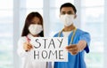 Asian doctor or nurse with Stay Home sign Royalty Free Stock Photo