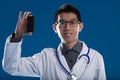 Asian doctor promotes digital device, telemedicine Royalty Free Stock Photo