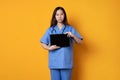 An asian doctor standing in uniform while showing a tablet screen Royalty Free Stock Photo