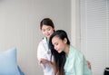 Asian doctor support to her patient female in hospital,Healthcare concept,Happy and smiling