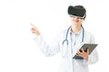 Asian doctor use digital tablet press VR headset screen Royalty Free Stock Photo