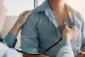 Asian doctor is using a stethoscope listen to the heartbeat of the elderly patient Royalty Free Stock Photo