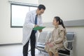 Asian Doctor is working in hospital , talking with sadness woman , medical health care concept Royalty Free Stock Photo