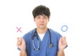 Asian doctor with a Yes or No sign Royalty Free Stock Photo