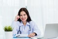 Doctor woman writing something on paperwork or clipboard white paper Royalty Free Stock Photo