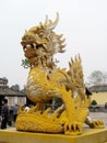 Asian dragon yellow sculpture Royalty Free Stock Photo