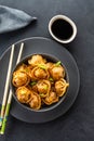 Asian dumplings in bowl, chopsticks, plates. Asian table setting. Chinese dumplings for dinner. Selective focus. Asian Royalty Free Stock Photo