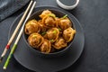 Asian dumplings in bowl, chopsticks, plates. Asian table setting. Chinese dumplings for dinner. Selective focus. Asian Royalty Free Stock Photo